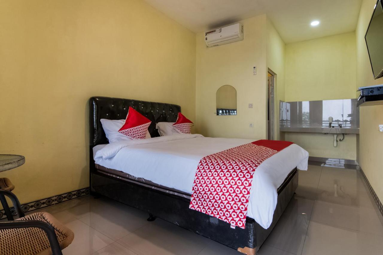 Отель Oyo 3050 Hotasi Seaview Syariah Аньер Экстерьер фото
