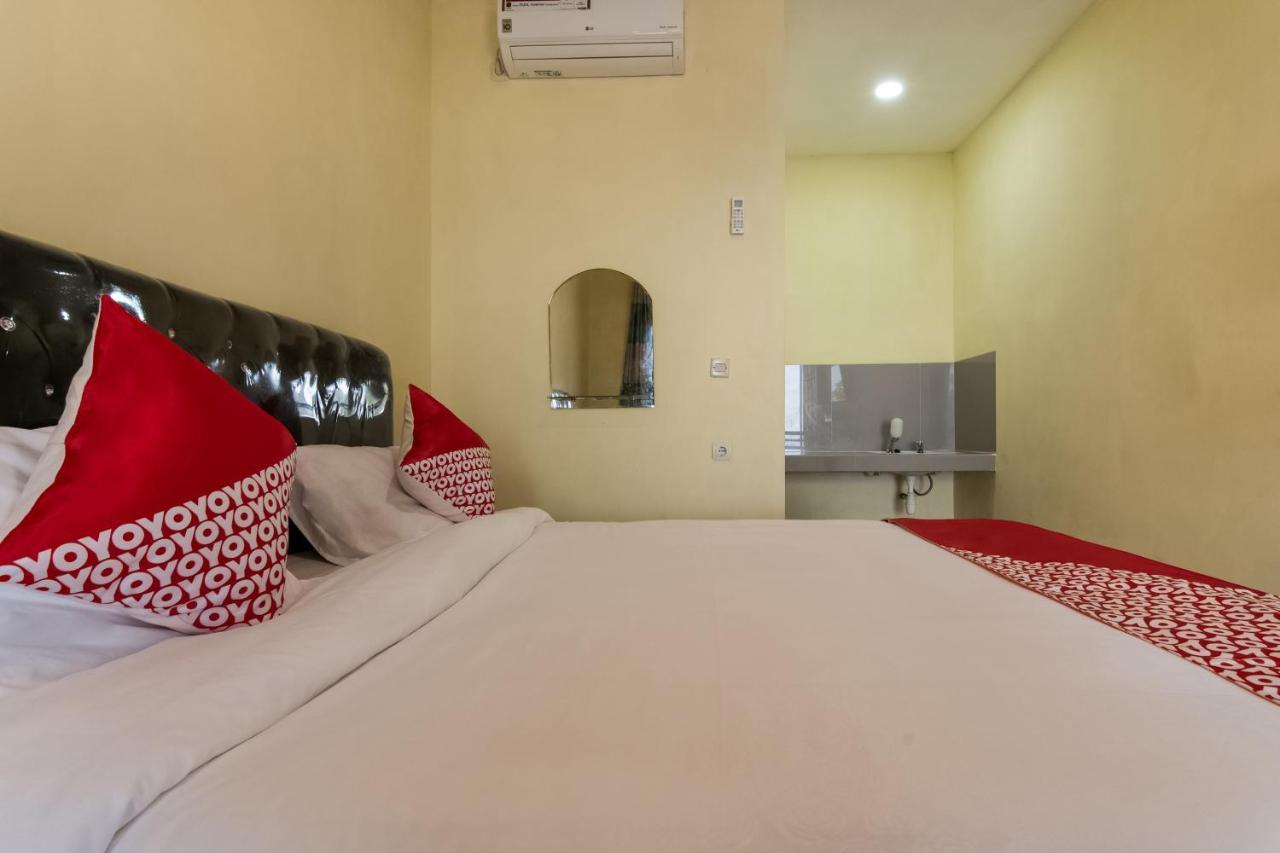 Отель Oyo 3050 Hotasi Seaview Syariah Аньер Экстерьер фото